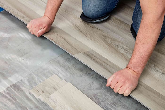 Laying laminate flooring on hot sale concrete